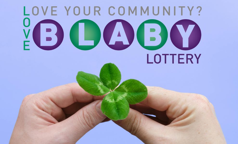 Hands holding a four leaf clover with the Love Blaby Lottery image